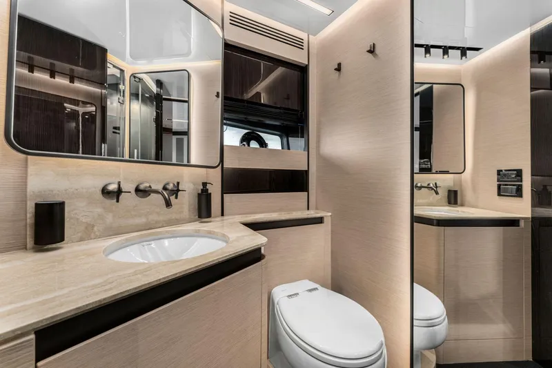Latitude Yacht Photos Pics Luxurious bathroom interior of 2022 Azimut S10 yacht with modern fixtures and elegant design.