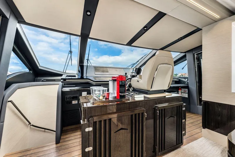 Latitude Yacht Photos Pics Luxurious interior of 2022 Azimut S10 yacht with modern helm and elegant design.
