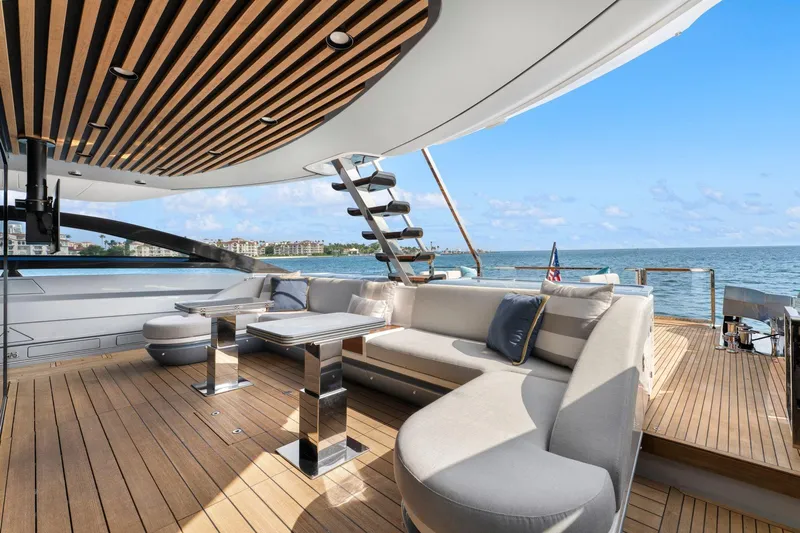 Latitude Yacht Photos Pics Luxurious 2022 Azimut S10 yacht deck with elegant seating and ocean view.
