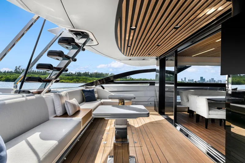 Latitude Yacht Photos Pics Luxurious 2022 Azimut S10 yacht interior with modern seating and elegant wooden finishes.