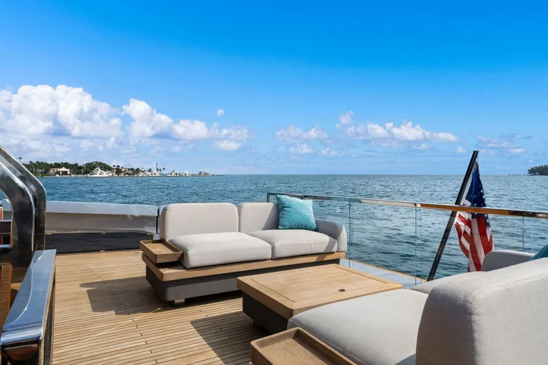 Latitude Yacht Photos Pics Luxurious 2022 Azimut S10 yacht deck with ocean view and comfortable seating.