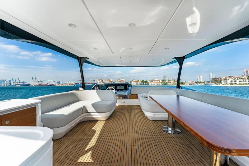 Latitude Yacht Photos Pics Luxurious 2022 Azimut S10 yacht interior with elegant seating and scenic ocean view.