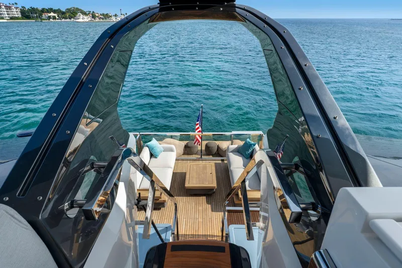Latitude Yacht Photos Pics Luxurious 2022 Azimut S10 yacht with elegant deck seating and ocean view.