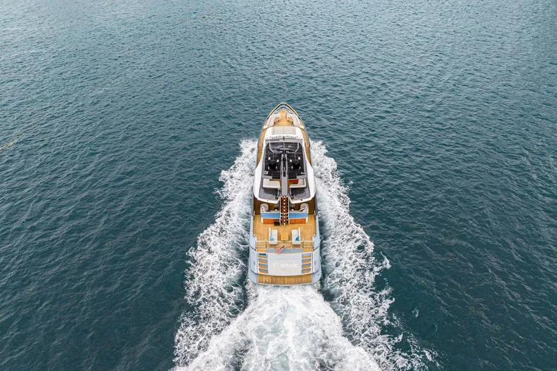 Latitude Yacht Photos Pics Azimut S10 2022 luxury yacht cruising on open sea, aerial view.