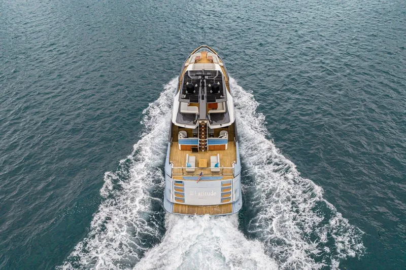 Latitude Yacht Photos Pics 2022 Azimut S10 yacht cruising on open water, aerial view.
