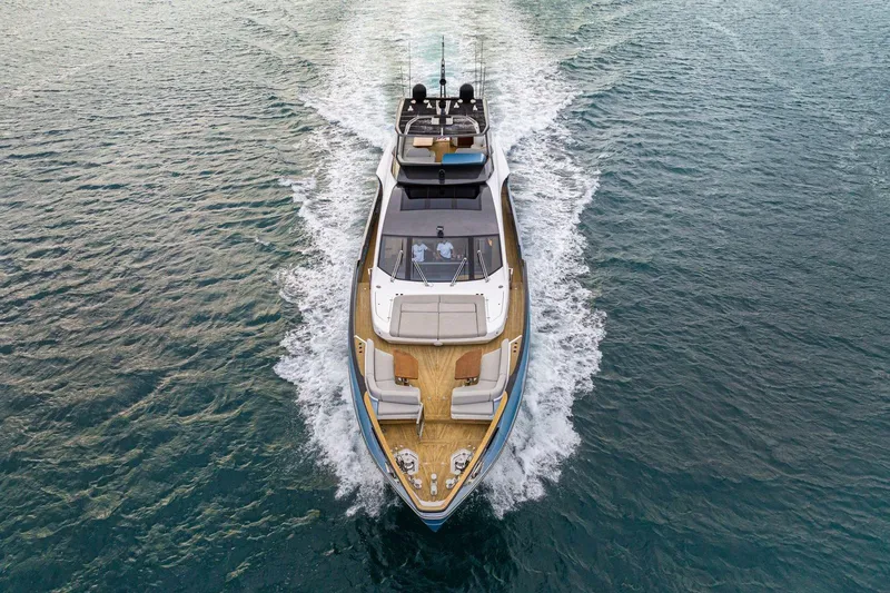 Latitude Yacht Photos Pics 2022 Azimut S10 yacht cruising on open water, aerial view.
