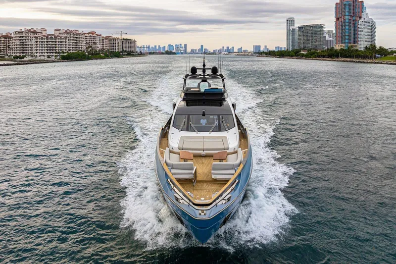 Latitude Yacht Photos Pics 2022 Azimut S10 yacht cruising in a scenic urban waterway.
