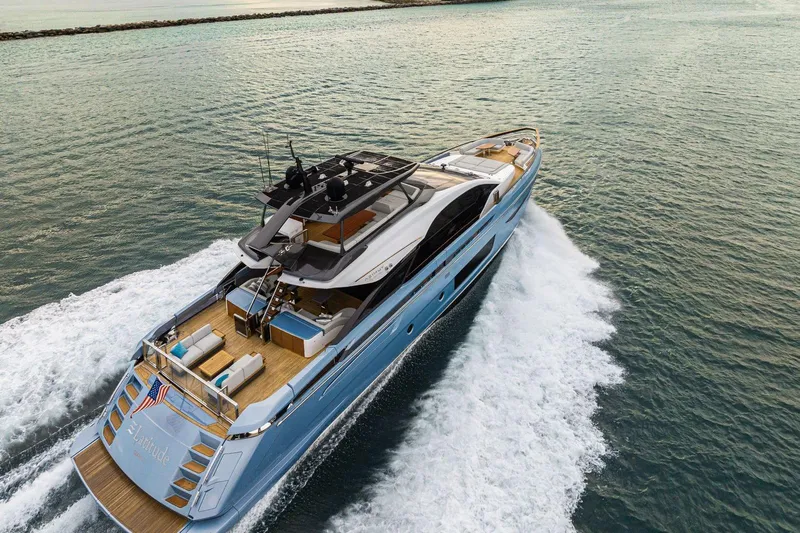 Latitude Yacht Photos Pics Luxury 2022 Azimut S10 yacht cruising on open water, showcasing sleek design and elegance.