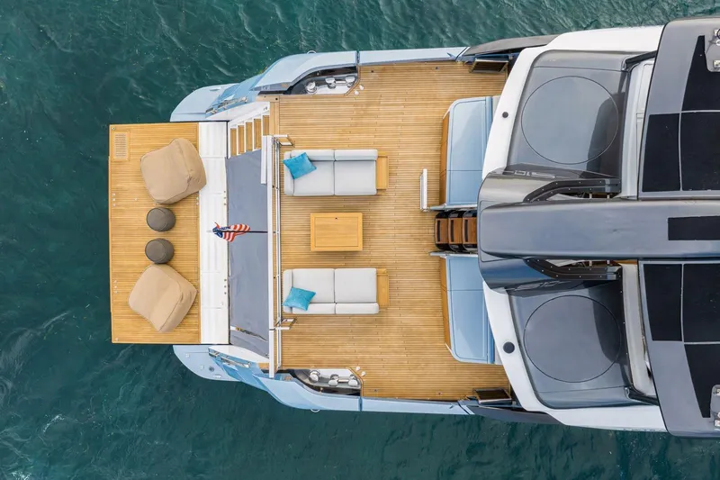 Latitude Yacht Photos Pics Aerial view of 2022 Azimut S10 yacht deck with seating and ocean backdrop.