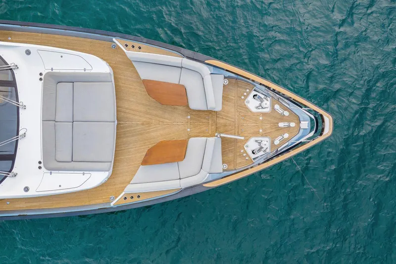 Latitude Yacht Photos Pics Aerial view of 2022 Azimut S10 yacht's elegant deck on blue water.