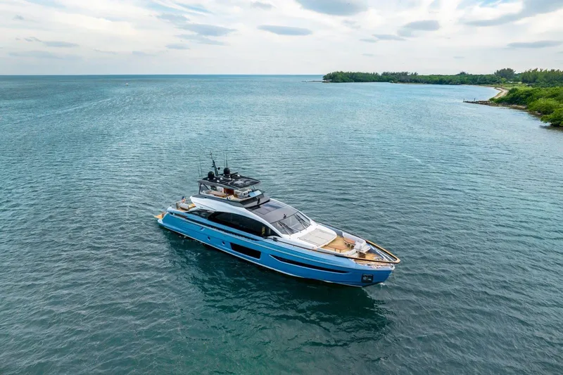 Latitude Yacht Photos Pics Luxury 2022 Azimut S10 yacht cruising on serene blue waters.