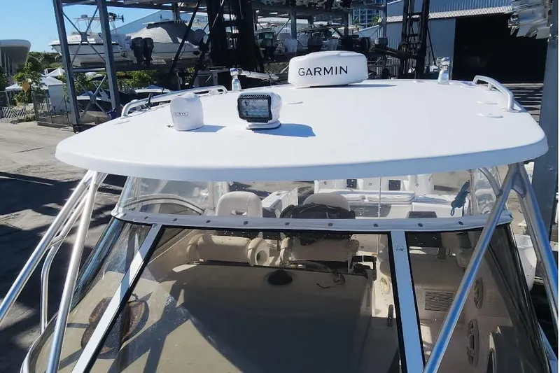  Yacht Photos Pics 2017 Fountain 38 Sportfish Cruiser with Garmin equipment on deck, docked at marina.