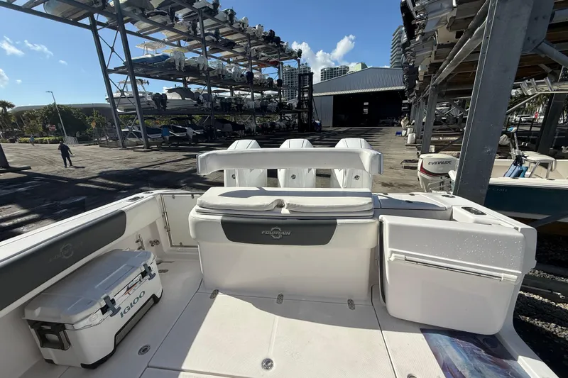  Yacht Photos Pics 2017 Fountain 38 Sportfish Cruiser docked with storage racks in background.