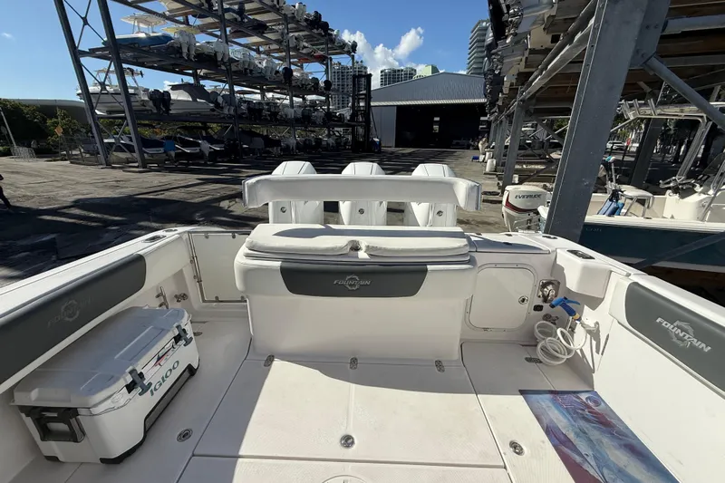  Yacht Photos Pics 2017 Fountain 38 Sportfish Cruiser boat interior at marina with stacked boats in background.