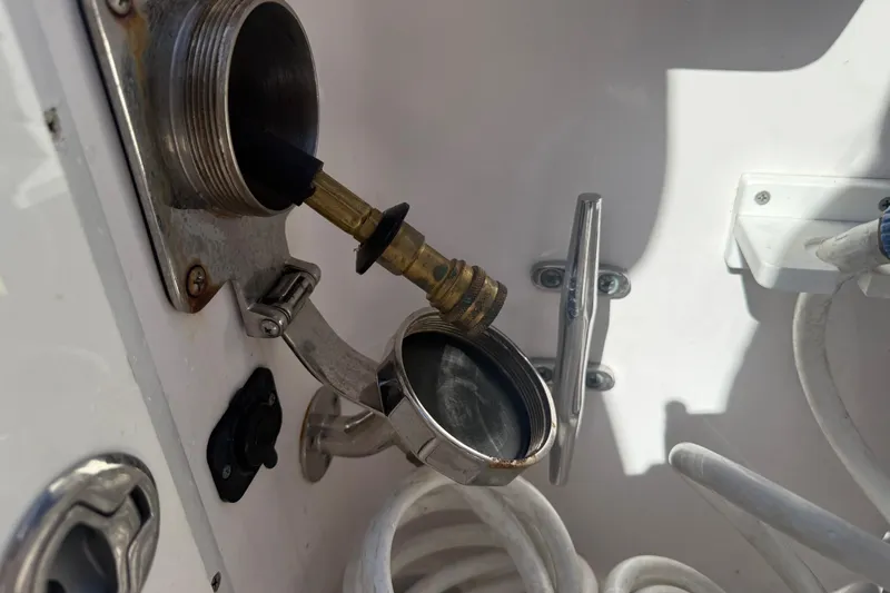 Yacht Photos Pics Fuel inlet and hose on a 2017 Fountain 38 Sportfish Cruiser boat.