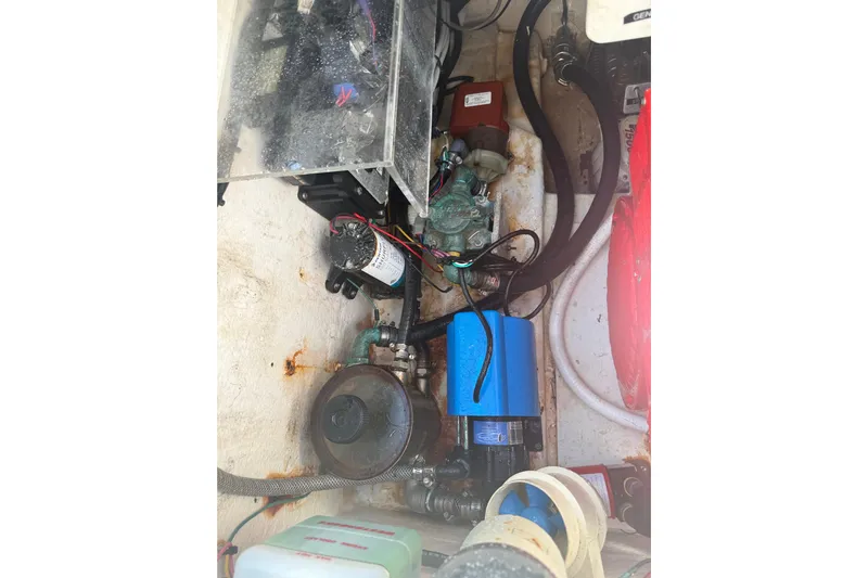  Yacht Photos Pics Engine compartment of a 2017 Fountain 38 Sportfish Cruiser with visible components and wiring.