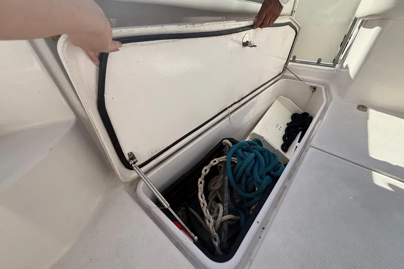  Yacht Photos Pics Open storage compartment on 2017 Fountain 38 Sportfish Cruiser with ropes and equipment.