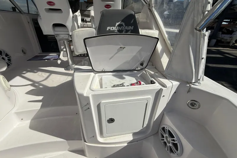  Yacht Photos Pics 2017 Fountain 38 Sportfish Cruiser interior with open storage compartment and seating.