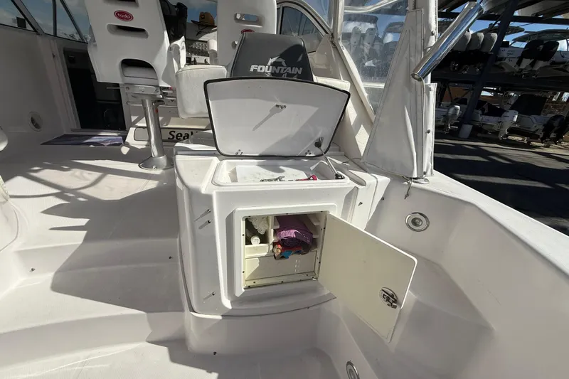  Yacht Photos Pics 2017 Fountain 38 Sportfish Cruiser interior with open storage compartments.