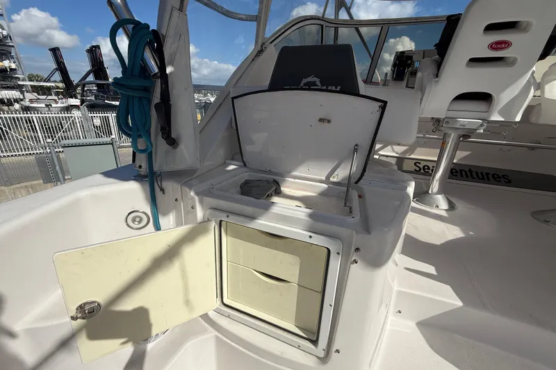  Yacht Photos Pics 2017 Fountain 38 Sportfish Cruiser interior with open storage compartments and seating.