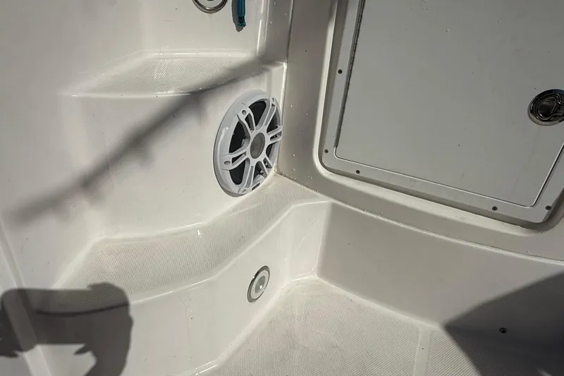  Yacht Photos Pics 2017 Fountain 38 Sportfish Cruiser interior with speaker and storage compartment.