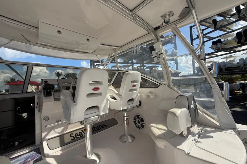  Yacht Photos Pics 2017 Fountain 38 Sportfish Cruiser interior with helm seats and modern controls.