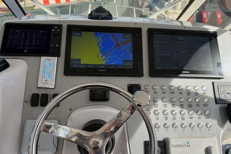  Yacht Photos Pics 2017 Fountain 38 Sportfish Cruiser dashboard with Garmin navigation displays and control panel.