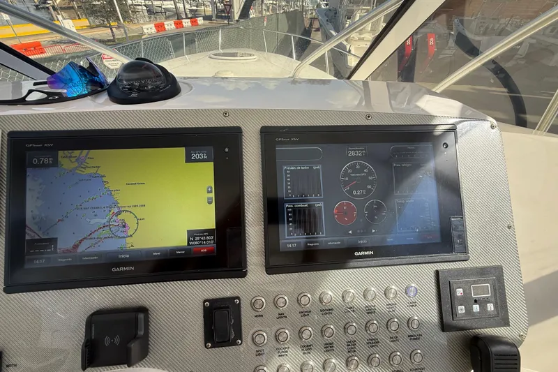  Yacht Photos Pics 2017 Fountain 38 Sportfish Cruiser dashboard with Garmin navigation displays and control panel.