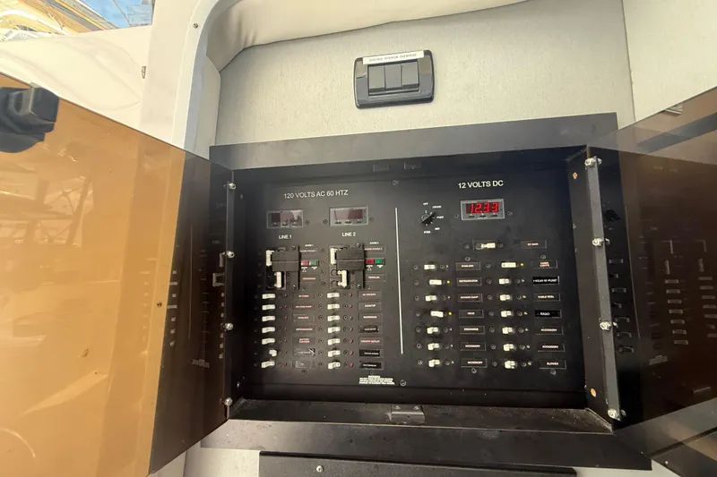  Yacht Photos Pics Electrical panel on 2017 Fountain 38 Sportfish Cruiser, showcasing AC and DC voltage controls.