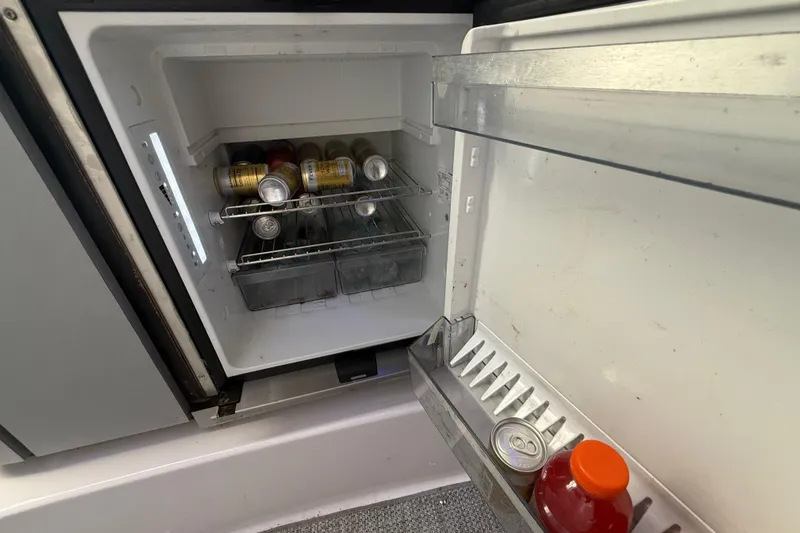  Yacht Photos Pics Open refrigerator on 2017 Fountain 38 Sportfish Cruiser, stocked with beverages.