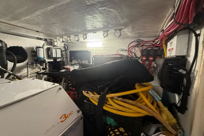  Yacht Photos Pics Engine room of 2017 Fountain 38 Sportfish Cruiser with cables and equipment.