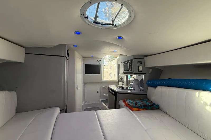  Yacht Photos Pics Interior of 2017 Fountain 38 Sportfish Cruiser with modern amenities and white seating.