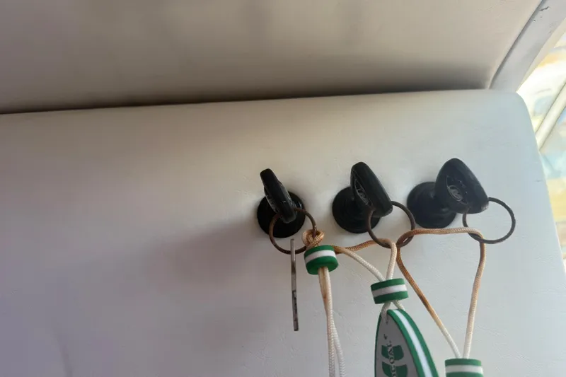  Yacht Photos Pics Keys hanging on a 2017 Fountain 38 Sportfish Cruiser interior wall.