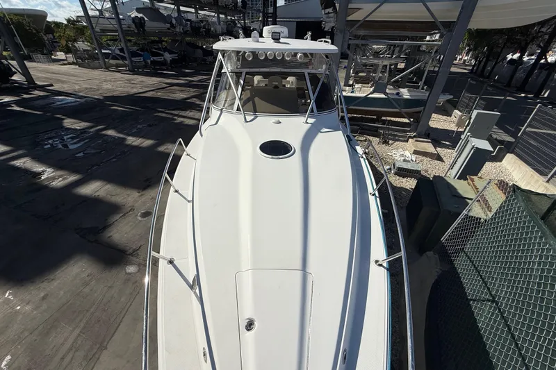  Yacht Photos Pics 2017 Fountain 38 Sportfish Cruiser docked, top view showcasing sleek design and spacious deck.