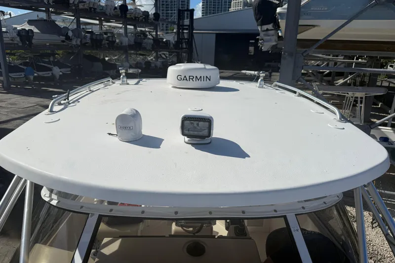  Yacht Photos Pics 2017 Fountain 38 Sportfish Cruiser with Garmin equipment on deck, docked in marina.