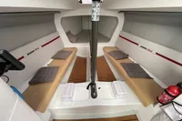 Interior of 2020 Dehler 30 sailboat with seating, cushions, and wooden flooring.