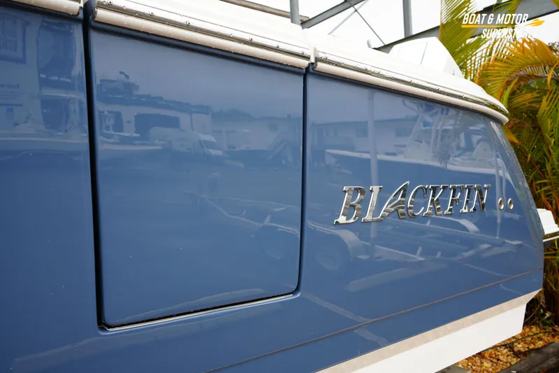  Yacht Photos Pics 2026 Blackfin 332 CC boat with sleek blue exterior and chrome logo.