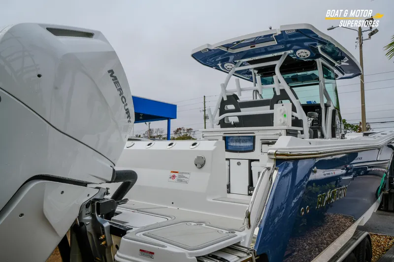  Yacht Photos Pics 2026 Blackfin 332 CC boat with Mercury engine at dealership.