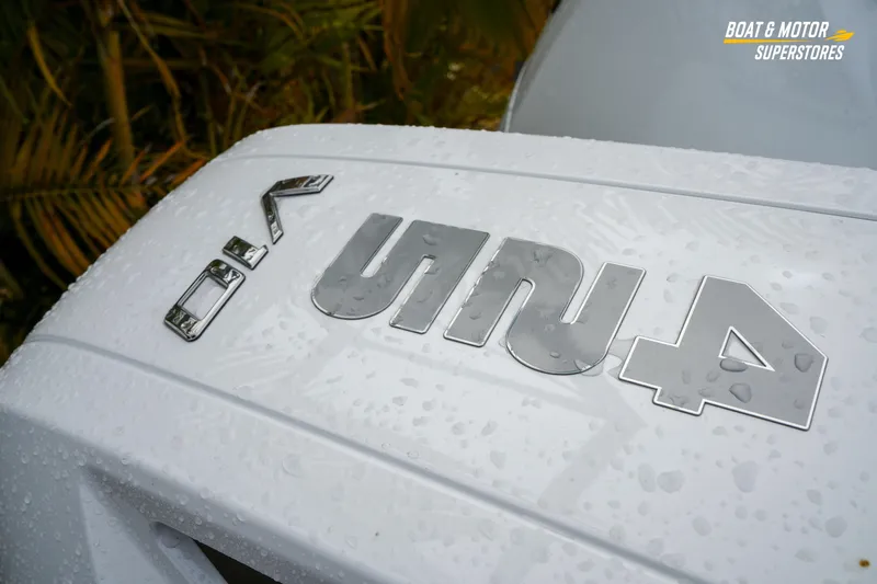  Yacht Photos Pics 2026 Blackfin 332 CC boat with wet surface and logo detail.