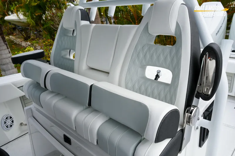  Yacht Photos Pics 2026 Blackfin 332 CC boat seating with white and gray upholstery, featuring diamond stitching.