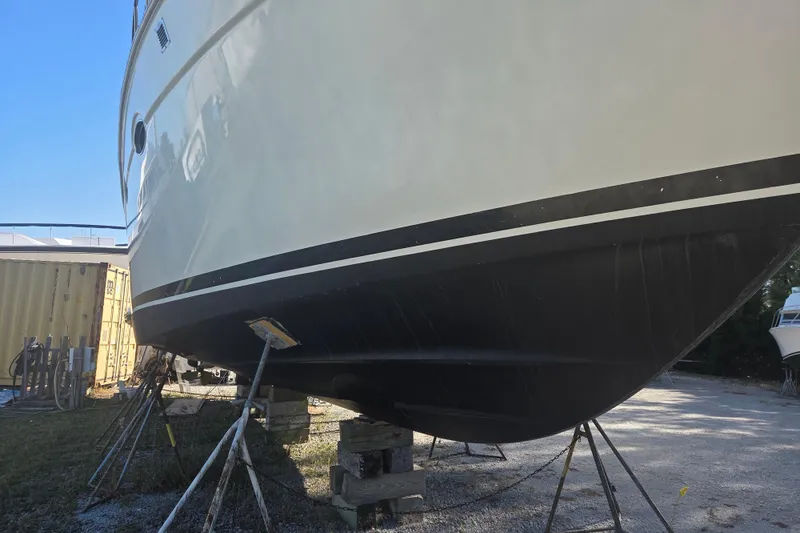 Pier Pressure Yacht Photos Pics 2000 Carver 450 Voyager Pilothouse yacht on stands, side view, outdoors.