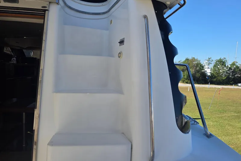 Pier Pressure Yacht Photos Pics Staircase on 2000 Carver 450 Voyager Pilothouse yacht, exterior view.