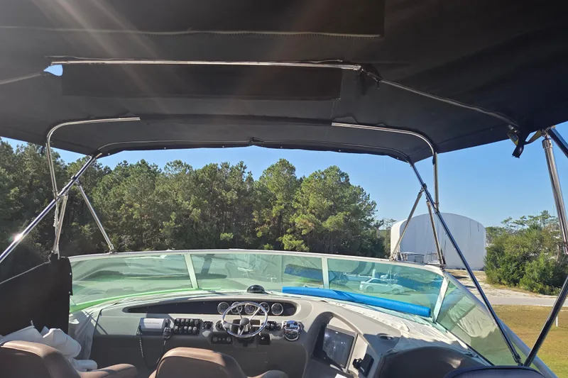 Pier Pressure Yacht Photos Pics Interior view of 2000 Carver 450 Voyager Pilothouse with canopy and dashboard.