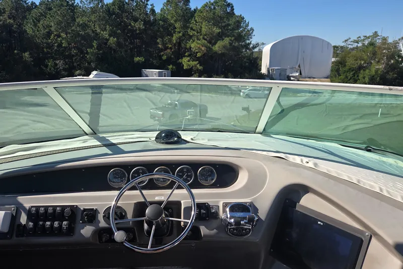 Pier Pressure Yacht Photos Pics 2000 Carver 450 Voyager Pilothouse helm with steering wheel and instrument panel.