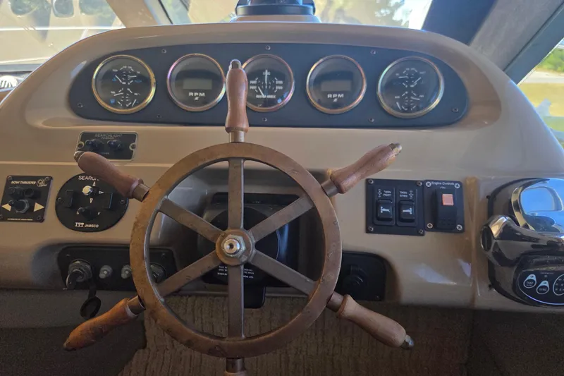 Pier Pressure Yacht Photos Pics Steering wheel and dashboard of 2000 Carver 450 Voyager Pilothouse yacht.
