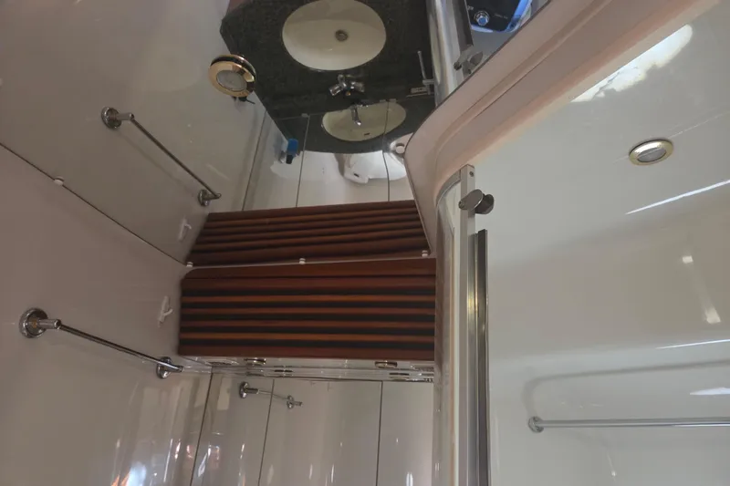 Pier Pressure Yacht Photos Pics Bathroom interior of 2000 Carver 450 Voyager Pilothouse with sink and shower.
