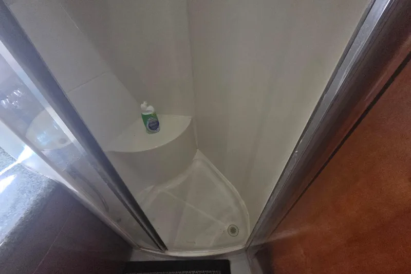 Pier Pressure Yacht Photos Pics Shower area in 2000 Carver 450 Voyager Pilothouse yacht with soap bottle.