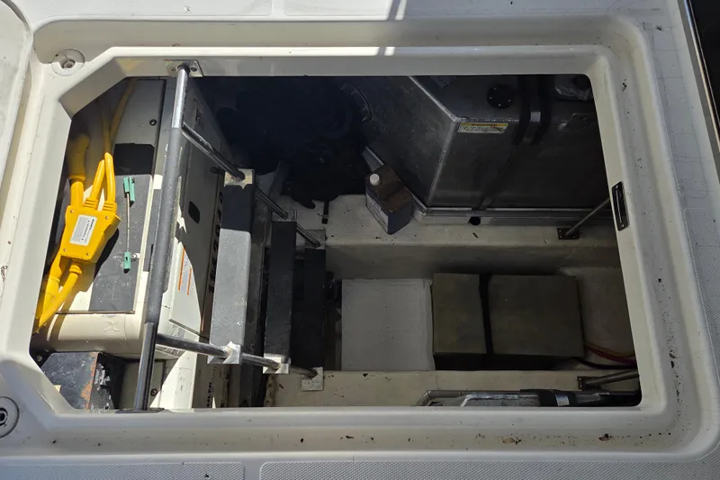 Pier Pressure Yacht Photos Pics Engine compartment of a 2000 Carver 450 Voyager Pilothouse with visible wiring and components.