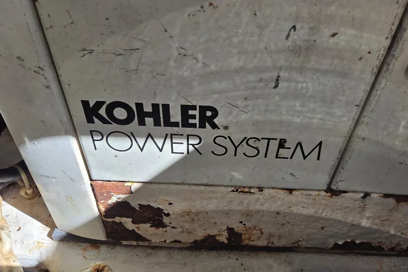 Pier Pressure Yacht Photos Pics Kohler power system on 2000 Carver 450 Voyager Pilothouse, showing rust and wear.