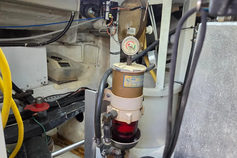 Pier Pressure Yacht Photos Pics Engine room of 2000 Carver 450 Voyager Pilothouse with fuel filter system.